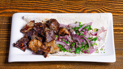 Lamb kebab on plate top view