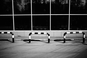 Empty car parking near supermarket transportation black & white backdrop