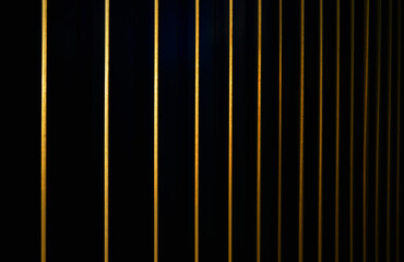 Illuminated metallic surface in vertical orientation backdrop
