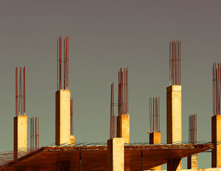 Framing armature at construction site during sunset backdrop