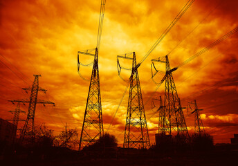 Industrial power lines during sunset background