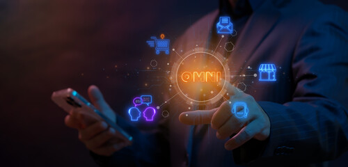 Omni Channel marketing concept. Digital online for business and social media marketing. Businessman using smartphone to operate with omni channel icons on virtual screen.