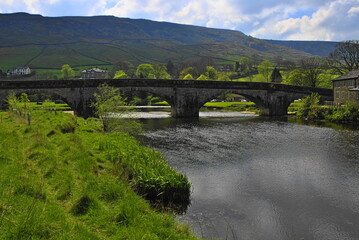 Historic Arched Bridge over the River Wharfe at Burnsall in Wharfedale, North Yorshire, England, UK 