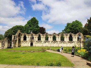 The ruins of ancient buildings in York, England, people are traveling, blue sky and white clouds on...