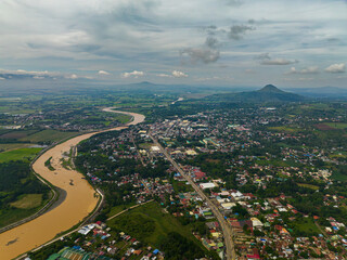 Fototapeta premium Drone view of Valencia City with river in mountain province. Mindanao, Philippines.