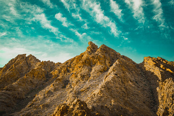 sunset in the mountains, landscape with sky, beautiful rock with blue sky during daytime - Powered by Adobe