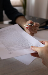Tenant receiving the keys and the contract for his property. Real state concept