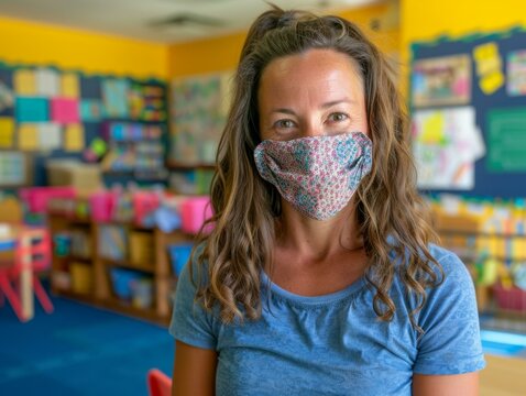 Early childhood educator wearing a facial mask in a classroom - Powered by Adobe