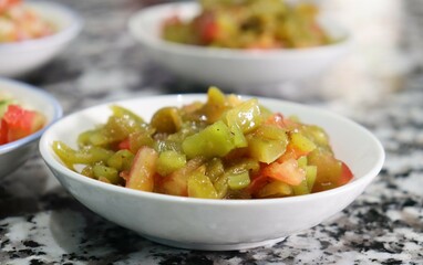 Traditional Moroccan Salad - Fresh Diced Vegetables, Tomato, and Green Peppers in Bowl - Authentic, Healthy Dish