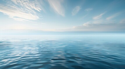 The shimmering expanse of the ocean's surface under a tranquil sky