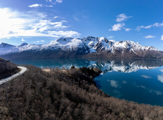 Panoramic drone view of Holandsfjord and Nordfjord in Nordland county. In the background is the Svartisen glacier, Norway's second largest glacier
