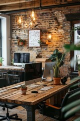 workspace with computers on a wooden table in a brick room