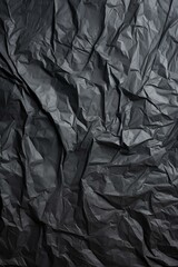 Black crumpled paper texture background