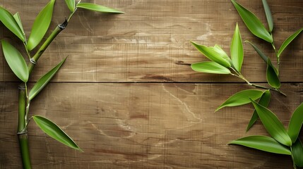 Fresh green bamboo leaves on a textured wooden background, creating a peaceful natural scene.