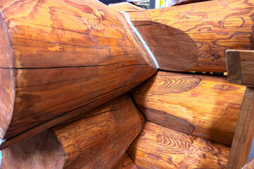 Corner of a log house. Laying logs for the construction of a log house.