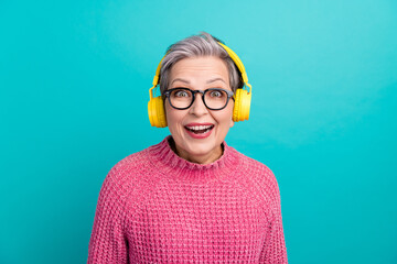Portrait of impressed ecstatic person dressed knit pullover in headphones astonished staring...
