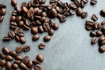 Close-up view of coffee beans scattered on a rustic burlap background