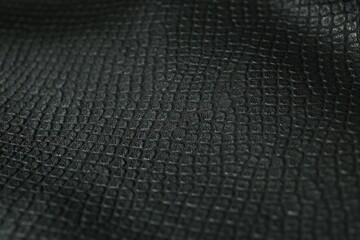 Black natural leather as background, closeup view