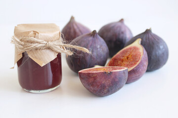 Fresh ripened purple figs. Creative composition a decorative banner of whole and sliced exotic...