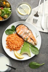 Healthy food high in vegetable fats served on grey textured table, flat lay