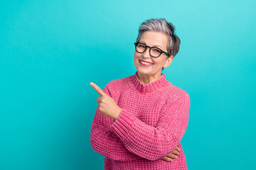 Photo of intelligent smart person dressed knitwear sweater in glasses indicating at offer empty...