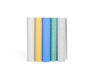 Different colorful wallpaper rolls isolated on white