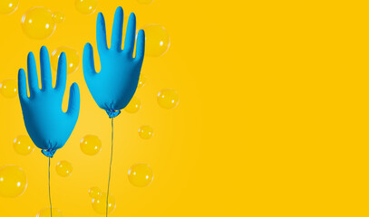 Cleaning concept. Gloves for cleaning in the form of an inflatable ball on a yellow background. Spring cleaning.
