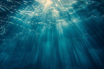 underwater ocean scene with sunlight rays piercing through blue water scuba diving background