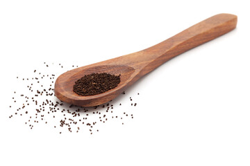 Front view of a wooden spoon filled with Organic snapdragon (Antirrhinum majus) seeds. Isolated on a white background.