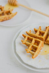 Waffle with honey. Aesthetic composition. Food Styling.
