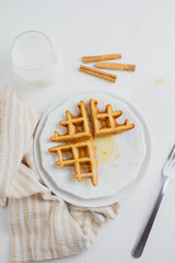 Waffle with honey. Aesthetic composition. Food Styling.