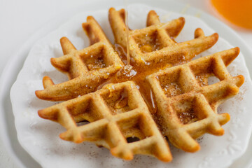 Waffle with honey. Aesthetic composition. Food Styling.