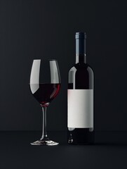 A bottle of wine with white labeland a wine glass are on a table, black background
