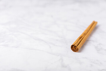 Ceylon cinnamon.Cinnamon sticks on a textured wooden background. Cinnamon roll and powder. Spicy spice for baking, desserts and drinks. Fragrant ground cinnamon. Close-up. Place for text. copy space