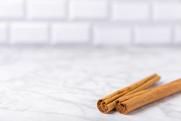 Ceylon cinnamon.Cinnamon sticks on a textured wooden background. Cinnamon roll and powder. Spicy spice for baking, desserts and drinks. Fragrant ground cinnamon. Close-up. Place for text. copy space