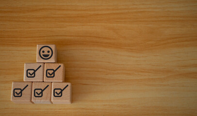 Emoticon face Customer service evaluation concept Hold up a cube with a checkbox on Excellent Smile...