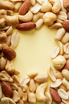 background close up of peanuts, nuts and almonds