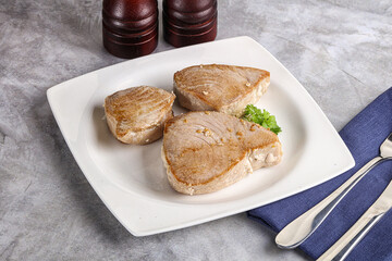 Roasted red tuna steak in the plate