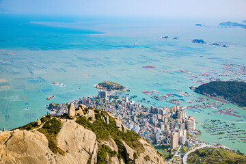 High angle view of the bay and fishing village on the top of the flag crown of Lianjiang County,...