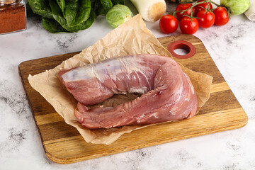 Uncooked raw pork tenderloin with spices