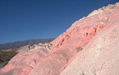 hill of seven colors argentina on a sunny day
