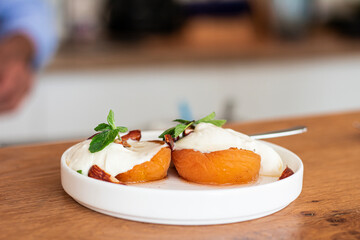 Grilled apricots with buratta cheese, grilled almonds Healthy breakfast 