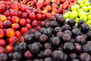 Different plum sell in the fruit store in the market