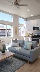 A modern living room with a large couch, coffee table, rug, and kitchen with stainless steel appliances