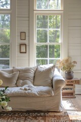 A Cozy Living Room With a Large Window and a Comfortable Couch