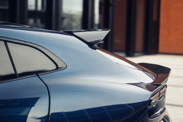 Carbon spoiler on the trunk of modern luxury car