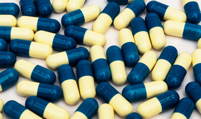 A background of white and blue vitamins, tablets. Medication. Antibiotics, health concepts.