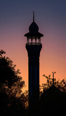 Vertical recreation of minaret or alminar of a mosque at sunset