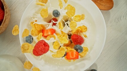 Freeze Motion of Falling Cereals into Bowl with Milk.