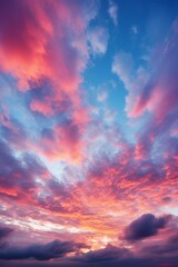 Fototapeta premium A vivid sunset sky with pink, blue, and yellow colors